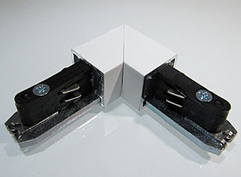 90 degree track connector for the tracks of the 230V track system DUOLARE from Bruck - here the variant in surface white